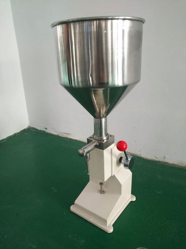 A03 Máquina manual de llenado de botellas de crema de mermelada pasta de jugo pasta de dientes loción de miel aceite de miel máquina de llenado líquido