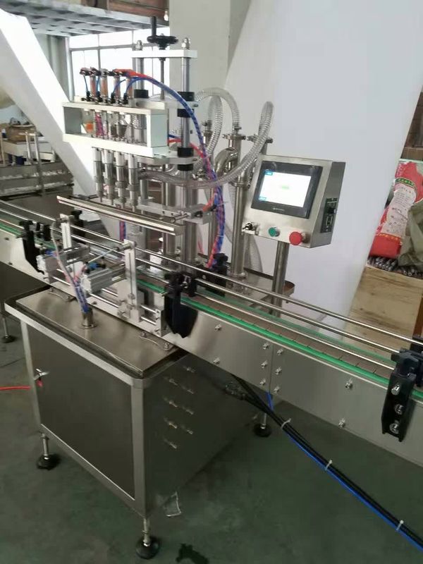 Máquina de llenado en línea 4 boquillas Máquina de llenado de líquido de desbordamiento automático Llenador de botellas de líquido para jugo de bebida