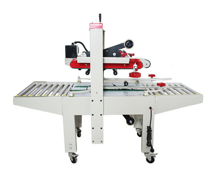 Fxj-6050 Alta velocidad ajustable cinta superior inferior eléctrica estable cajas de cartón automáticas cajas sellador de caja máquina de sellado de cartón