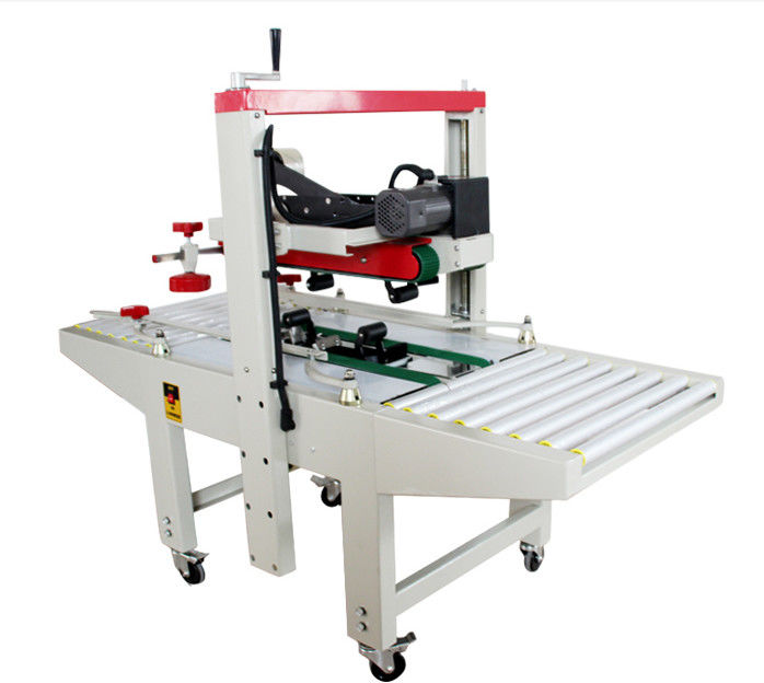 Fxj-6050 Alta velocidad ajustable cinta superior inferior eléctrica estable cajas de cartón automáticas cajas sellador de caja máquina de sellado de cartón